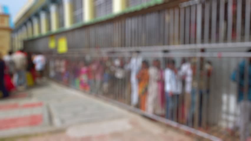 Bokeh view of devotees visit Sri Chamundeshwari Temple, located on Chamundi Hills near Mysore, India. Blurred background footage.
