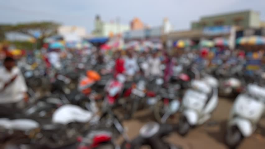 Bokeh view of devotees visit Sri Chamundeshwari Temple, located on Chamundi Hills near Mysore, India. Blurred background footage.