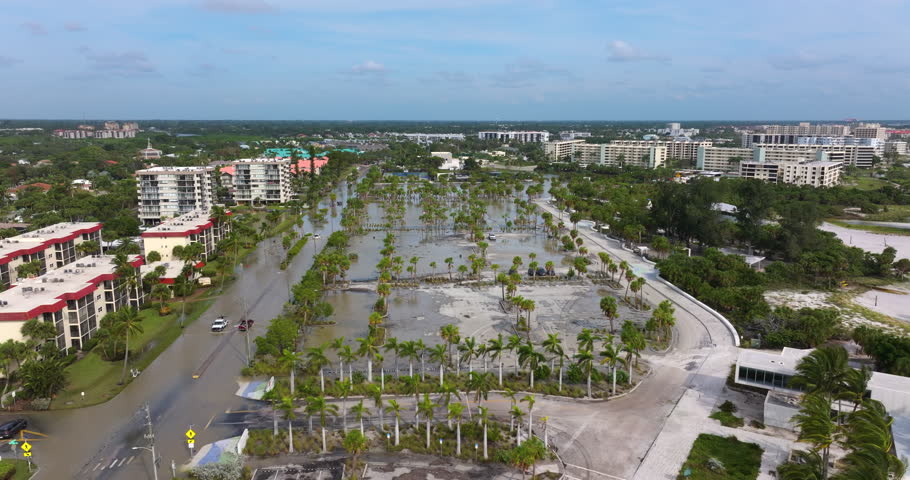 Flooded Siesta Key beach parking from hurricane storm surge water in Sarasota, Florida. Aftermath of natural disaster in USA south.