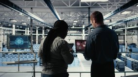 Team of server room technicians alerted by warning message on laptop causing infrastructure slowdowns. Teamworking data center colleagues see malfunction popup caused by software errors, camera A - Powered by Shutterstock - Get 15% off with code: PIKWIZARD15