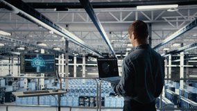 Software developer in data center checks AI dashboard using laptop during routine systems review. Server hub IT specialist tests artificial intelligence on notebook to check performance, camera A - Powered by Shutterstock - Get 15% off with code: PIKWIZARD15