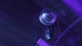 Close up of a disco ball reflecting purple and blue lights during a lively party atmosphere - Powered by Shutterstock - Get 15% off with code: PIKWIZARD15
