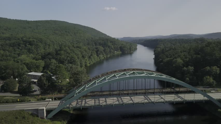 Drone lowers over Connecticut River on northside of United States Navy Seabees Bridge between New Hampshire and Vermont