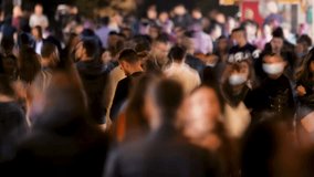 Timelapse Crowd of People Walking a Busy Street at Night. People in Motion Blur and Vibrant Town Atmosphere. Representing Urban Life and Activity Video Showing a Large Group Persons Along Outdoor 4k - Powered by Shutterstock - Get 15% off with code: PIKWIZARD15
