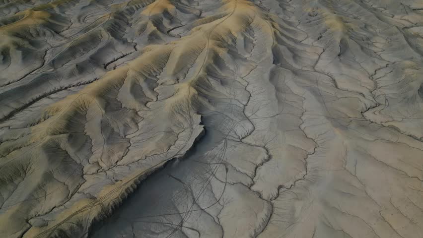 Aerial footage of Factory Butte texture fromation in Utah , otherworldly landscapes with unique rock formations. Abstract drone footage