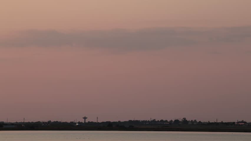 Cagliari, Sardinia, Italy A commercial airliner takes off at the Cagliari Elmas Airport at sunset.