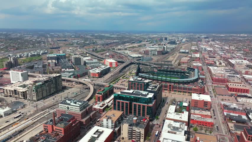 Downtown Denver Coors field Colorado Rockies Baseball Market Street Union Station summer spring rooftop tall buildings aerial drone sunny afternoon blue skies stormy clouds cityscape street forward