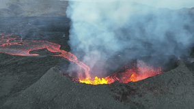 At the edge of the crater, there is a dark black mound, forming a rough wall of once melted rock. From the cracks, fiery lava gushed out, emitting a contrasting bright orange light. - Powered by Shutterstock - Get 15% off with code: PIKWIZARD15