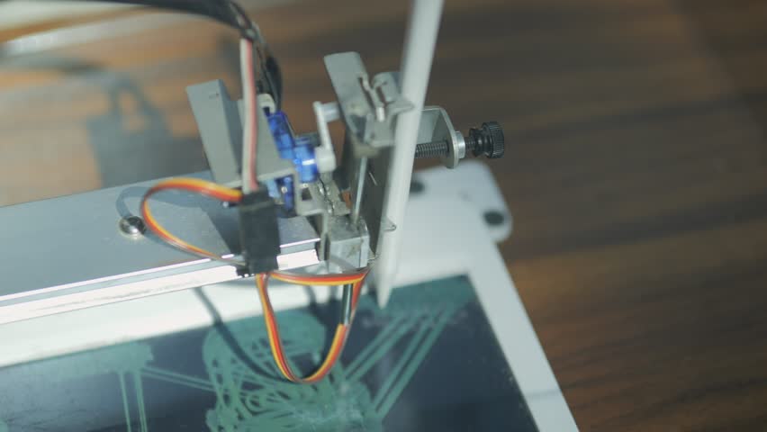 Tablet with a stylus on it. The tablet is displaying a drawing of a city. The drawing is of a futuristic city with tall buildings and a lot of technology. Scene is one of innovation and progress