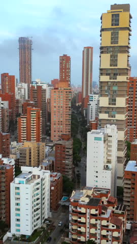 Breathtaking vertical video of Barranquilla skyline at sunset, showcasing towering skyscrapers in vivid colors under a serene sky. Perfect for social media, with a mobile-friendly format.