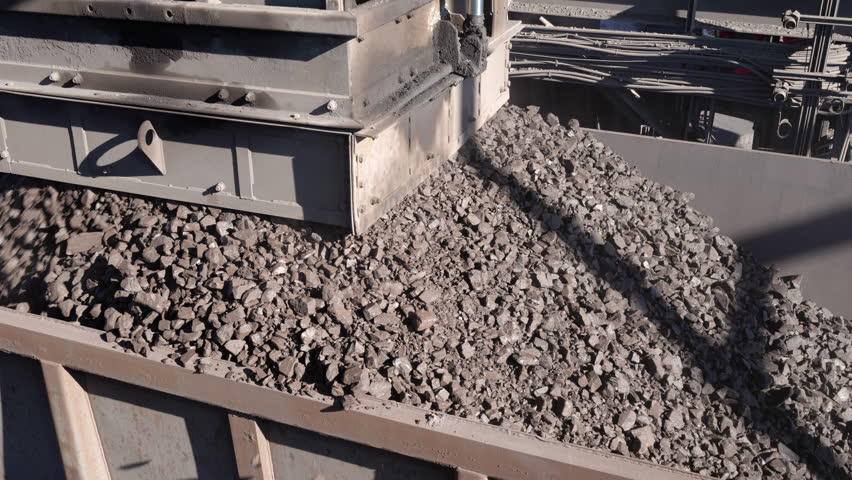 A Rapid Loading System loads manganese ore into a rail wagon on a mine
