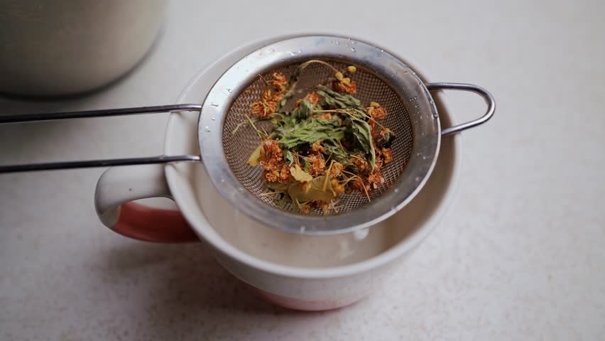 Herbal Remedy in Countryside as Boiling Water Prepares Cold Season Infusion