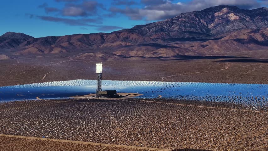 Aerial view of the Ivanpah Solar Electric Generating System with shimmering mirrors reflecting the sun