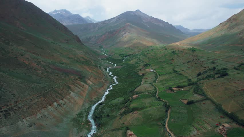 Beautiful drone view of valley in Skardu, Pakistan. Beautiful mountains, beautiful valley, lush green meadows, rural life, spa, nature, travelling, northern area of Pakistan, height, fresh blue water.