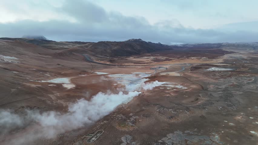 Aerial View of Iceland’s Geothermal Valley: Steam and Volcanic Terrain