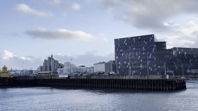 Iceland’s Coastal Lighthouse: Yellow Beacon and Snowy Peaks - Powered by Shutterstock - Get 15% off with code: PIKWIZARD15