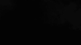 Dense vape smoke cloud being exhaled and expanding in the air over a dark backdrop. - Powered by Shutterstock - Get 15% off with code: PIKWIZARD15