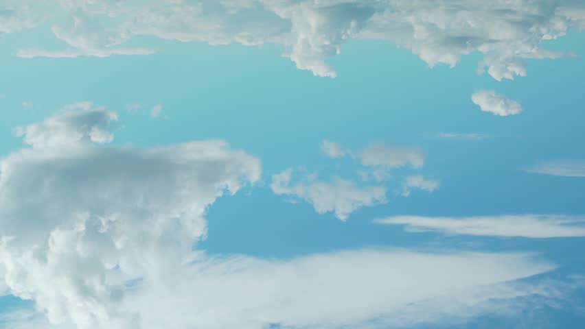 White Cotton Cumulus Clouds Float Across the Clear Blue Sky During the Day Time Lapse. Sunny Cloudy Weather. Atmosphere Aerial Drone View. Sunny Day, Azure Sky and Puffy White Clouds Background 4K.