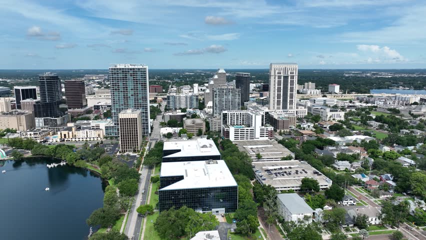 Corporate Buildings And Restaurants Near Eola Park Centre In Downtown Orlando, Florida, United States. Aerial Drone Shot