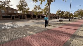 Adult woman running, stretching, hydrating, and doing knee lifts during outdoor fitness training in urban and sports environments - Powered by Shutterstock - Get 15% off with code: PIKWIZARD15