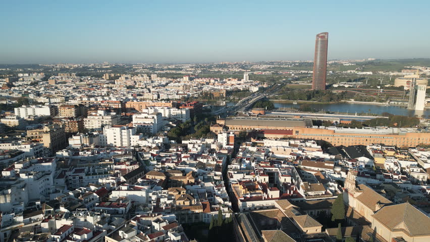 Panning footage of Seville, the capital of Andalusia, a province in southern Spain. Panoramic view, aerial capture.