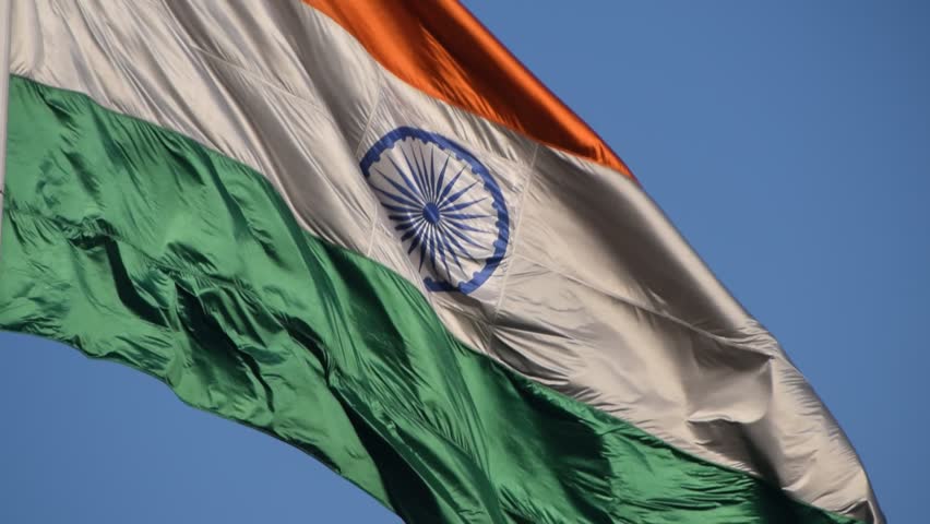 India flag flying high at Connaught Place with pride with plain white background, India flag fluttering, Indian Flag on Independence Day and Republic Day of India, tilt up shot, Har Ghar Tiranga