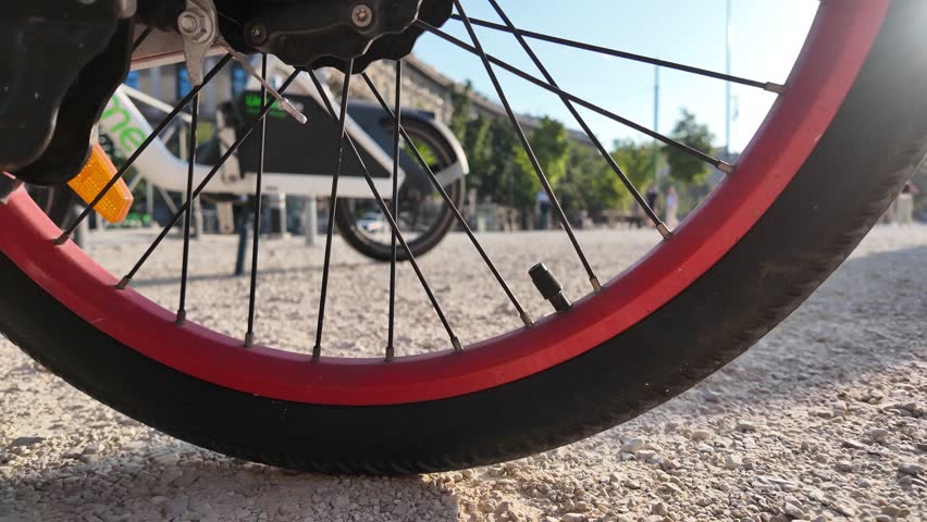 Milan, Italy: 08.08.2025. The wheel of a bicycle. A spinning bicycle wheel 