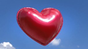 Glossy red heart-shaped balloon floats gently in blue sky with white clouds and stitched edge detail, for valentine’s promotion. - Powered by Shutterstock - Get 15% off with code: PIKWIZARD15