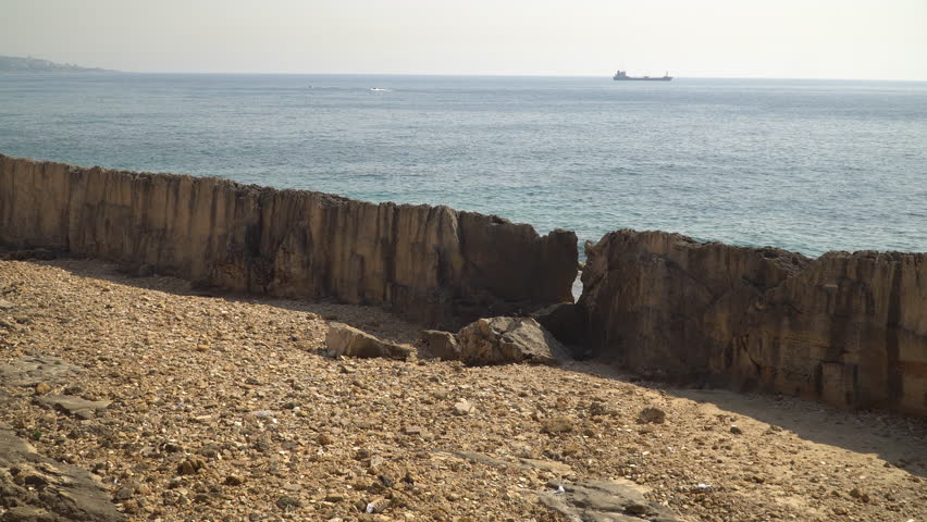 Panning video showcase the Phoenician wall, an ancient protective wall erected on the Mediterranean shore in Bartoun, Lebanon