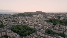 Aerial orbit around Edinburgh New Town and city centre with Arthur's Seat in background at golden hour, Edinburgh, Scotland, UK - Powered by Shutterstock - Get 15% off with code: PIKWIZARD15