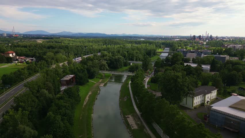River Ostravice leading to industrial skyline Ostrava landscape AERIAL