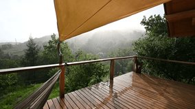 Raindrops Falling on a Wooden Deck in a Beautiful Natural Landscape with Sunlight Breaking Through - Powered by Shutterstock - Get 15% off with code: PIKWIZARD15
