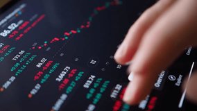 Close-up Person Analyzing Stock Market Graph on Digital Tablet Touch Screen. Businessman Checking Stock Market Data. Hand Gesture on Digital Tablet for Analyzing Stock Market. Forex Crypto Currency. - Powered by Shutterstock - Get 15% off with code: PIKWIZARD15