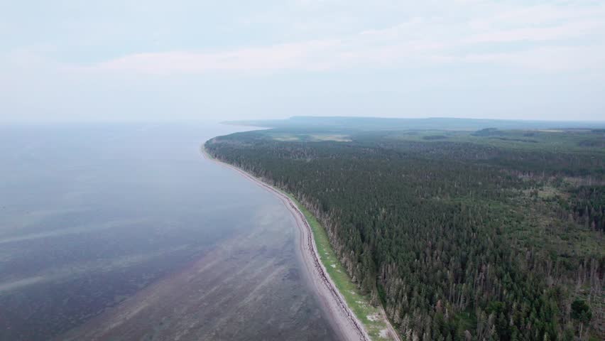 A Dirt and Stone Road Between the Forest and the Sea near the Waterfall Known as "Chute à Boule" in Anticosti Island, Quebec, Canada