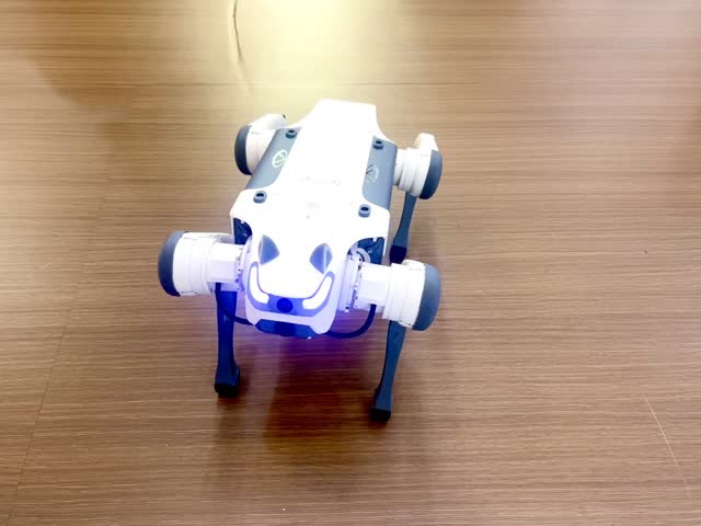A robot dog walking and playing around people at a technology trade show. Concept of robotics engineering innovation. 