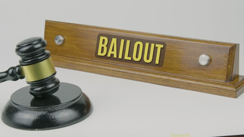 Bailout word or text engraved on a wooden nameplate with a gavel tapping once and three times, symbolizing financial rescue, government intervention, and economic relief on a white background