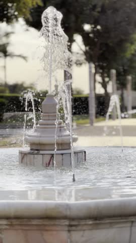 close-up of elegant marble fountain with flowing water at Al-Azhar Park, old cairo, vertical reel shot