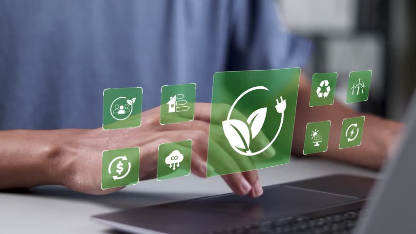 Renewable energy sources and alternative energy sources concept. Person using laptop with renewable energy icons on virtual screen.