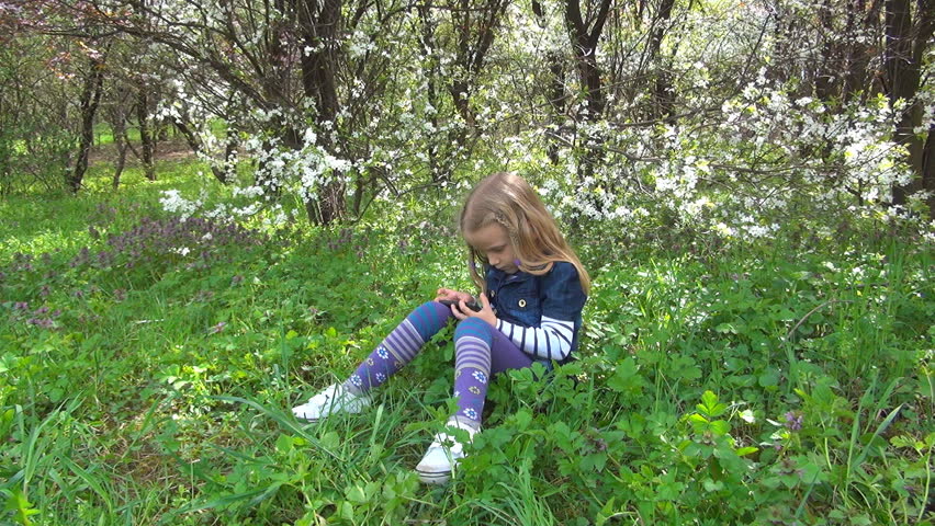 Child Playing on Touchscreen Phone, Girl with Smartphone in Park, Children