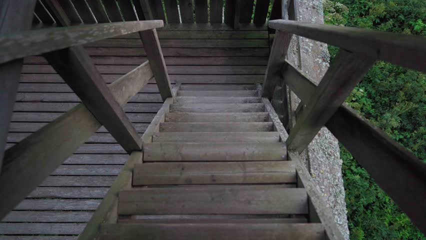 Looking down wooden stairs of bird watching tower in nature Finland