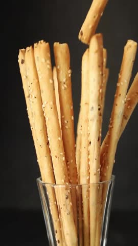 Grissini breadsticks whole grain cereal fresh delicious gourmet food background on the table rustic food top view copy space