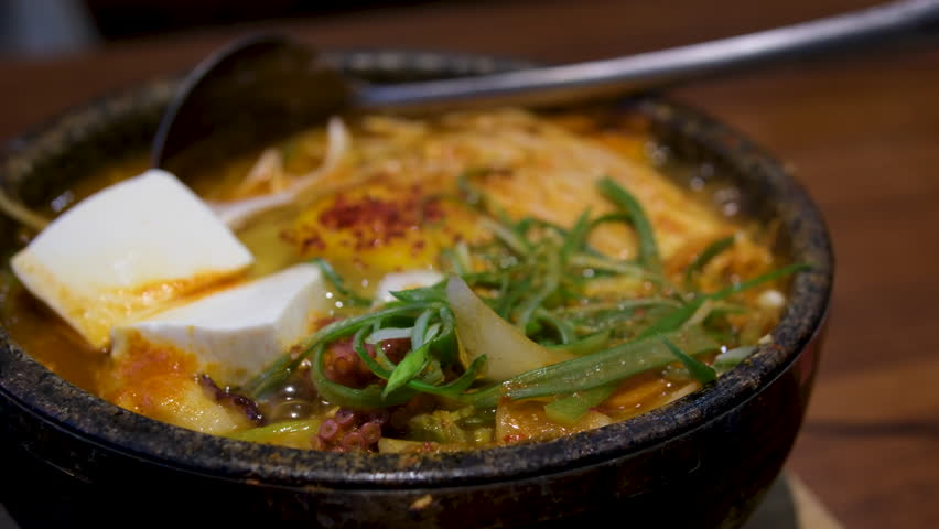 Tofu delicious soup. Hot boiling Korean spicy soft tofu stew, Sundubu jjigae