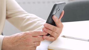 Retired woman connecting with family online using smartphone. - Powered by Shutterstock - Get 15% off with code: PIKWIZARD15