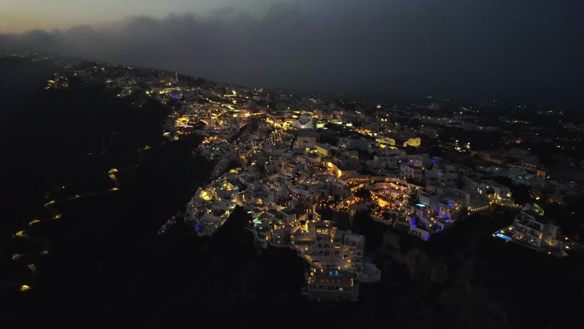 Sunset over Santorini with lights 4K