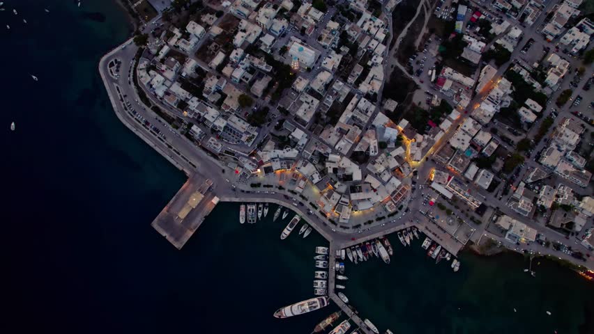 Top down over harbor at nighttime with lights 4K