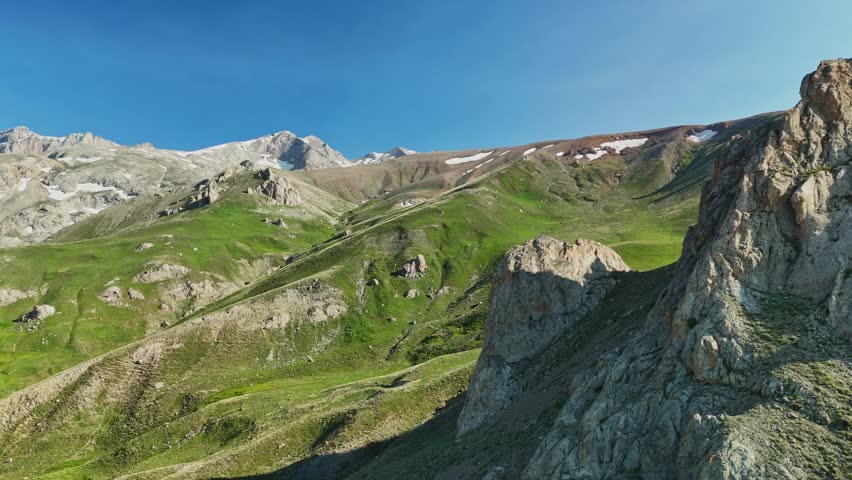 Aerial view of rocky mountains in summer, peaceful nature scene