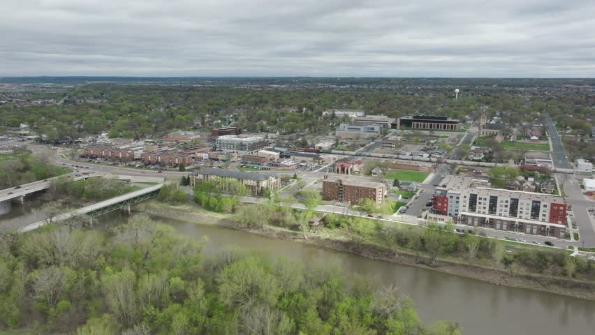 Minnesota River In The Foreground Of Downtown Shakopee In Minnesota, USA. - aerial shot