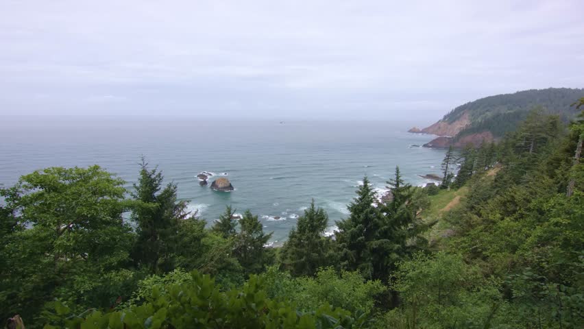 The Footage depicts the Oregon Coast, a 363-mile stretch of rugged shoreline in the Pacific Northwest, known for cliffs, beaches, and dense coastal forests.