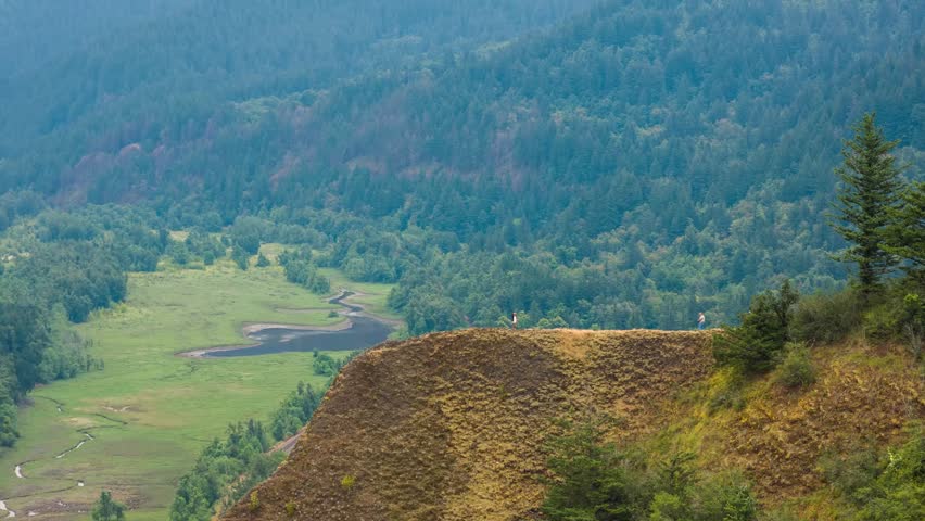 Footage displays a view of the Columbia River Gorge, a significant natural feature in the Pacific Northwest of the United States, showcasing cliffs and forests.