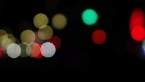The lights of cars speeding through the city at night. The front and rear lights that are out of focus. Moving bokeh circles from cars at night. A blurred city traffic background. dot of light - Powered by Shutterstock - Get 15% off with code: PIKWIZARD15